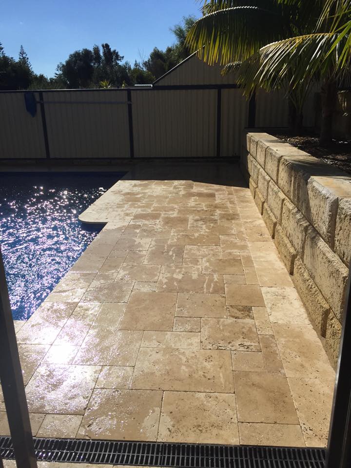 Limestone Paving in front of a retaining wall